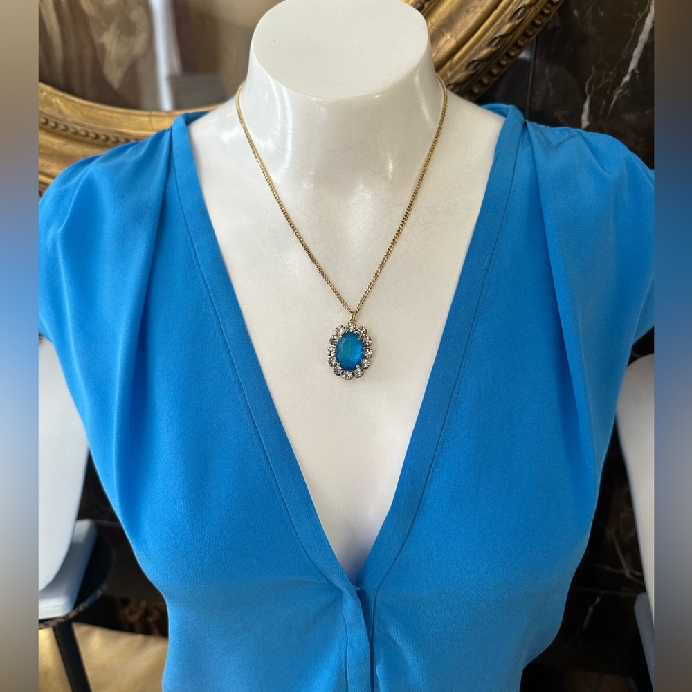 Bright Blue Crystal feminine stone surrounded by mini crystals.